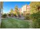 Landscaped backyard with artificial turf and a retaining wall at 3164 Rowan Brook Ave, Henderson, NV 89052