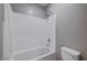 Clean bathroom with a shower/tub combo and white tile at 3164 Rowan Brook Ave, Henderson, NV 89052