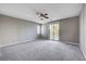 Spacious bedroom with carpet, ceiling fan and balcony access at 3164 Rowan Brook Ave, Henderson, NV 89052