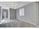 Bright dining area with tile floors and a modern chandelier at 3164 Rowan Brook Ave, Henderson, NV 89052
