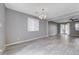 Open dining area with gray walls and gray tile floors at 3164 Rowan Brook Ave, Henderson, NV 89052