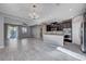 Open dining area with gray walls and gray tile floors at 3164 Rowan Brook Ave, Henderson, NV 89052