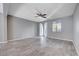 Living room with tile floors, ceiling fan and sliding glass doors at 3164 Rowan Brook Ave, Henderson, NV 89052