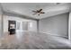Open living room with tile floors and ceiling fan at 3164 Rowan Brook Ave, Henderson, NV 89052