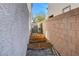 Side yard with raised garden beds and space for storage at 3164 Rowan Brook Ave, Henderson, NV 89052