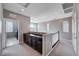 Upper hall with dark cabinets and laundry access at 3164 Rowan Brook Ave, Henderson, NV 89052
