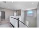 Upper hallway with carpeting and railing at 3164 Rowan Brook Ave, Henderson, NV 89052