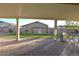 View of the backyard from the covered patio, showcasing artificial turf and water feature at 7047 Noble Flair Ct, Las Vegas, NV 89131