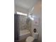 Cozy bathroom with a shower/tub combo and stylish tile surround at 7047 Noble Flair Ct, Las Vegas, NV 89131