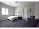 Comfortable bedroom with cozy chairs and carpet at 7047 Noble Flair Ct, Las Vegas, NV 89131