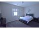Comfortable bedroom with a queen-sized bed, plush carpet, and bright natural light at 7047 Noble Flair Ct, Las Vegas, NV 89131