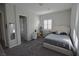 Spacious bedroom with plush carpet, a window, and a comfortable bed at 7047 Noble Flair Ct, Las Vegas, NV 89131