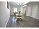 Dining room featuring chandelier lighting and a dining table set for four at 7047 Noble Flair Ct, Las Vegas, NV 89131