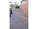View of paver driveway next to home at 7047 Noble Flair Ct, Las Vegas, NV 89131