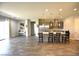 A bright, open-concept kitchen with stainless appliances, a large island, and modern finishes at 7047 Noble Flair Ct, Las Vegas, NV 89131