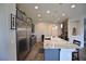 Kitchen featuring a granite island, stainless steel appliances, and pendant lighting at 7047 Noble Flair Ct, Las Vegas, NV 89131