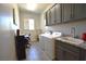 Well-organized laundry room with modern appliances and ample counter space at 7047 Noble Flair Ct, Las Vegas, NV 89131