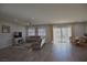 Open-concept living room featuring neutral tones, recessed lighting, and sliding glass doors at 7047 Noble Flair Ct, Las Vegas, NV 89131