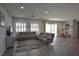 Bright and open living room with neutral tones, recessed lighting, and backyard view at 7047 Noble Flair Ct, Las Vegas, NV 89131