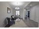 Bright living room with hardwood floors, chandelier, and a view to other rooms at 7047 Noble Flair Ct, Las Vegas, NV 89131