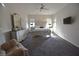 Large main bedroom with decorative furniture, television, and an inviting seating area at 7047 Noble Flair Ct, Las Vegas, NV 89131