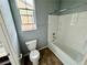 Small bathroom with tub shower combo and tile floor at 11416 Belmont Lake Dr # 102, Las Vegas, NV 89135