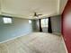 Bedroom with gray walls, burgundy curtains, and a ceiling fan at 11416 Belmont Lake Dr # 102, Las Vegas, NV 89135