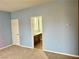 Bedroom with access to bathroom and neutral walls at 11416 Belmont Lake Dr # 102, Las Vegas, NV 89135