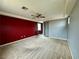 Main bedroom with gray and burgundy walls, carpet and ceiling fan at 11416 Belmont Lake Dr # 102, Las Vegas, NV 89135