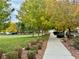 Walking path in community park with green grass and trees at 11416 Belmont Lake Dr # 102, Las Vegas, NV 89135