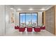 Contemporary dining room with modern lighting, seating for eight, and outdoor views at 1487 Reims Dr, Henderson, NV 89012