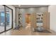 Bright home gym with an exercise bike, fitness ball, sauna and access to outdoor area at 1487 Reims Dr, Henderson, NV 89012