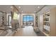 Well-equipped home gym with workout machines and panoramic views from the terrace at 1487 Reims Dr, Henderson, NV 89012