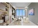 Bright home office with built-in shelves, desk, and a scenic outdoor view at 1487 Reims Dr, Henderson, NV 89012