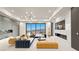 Open living area with modern decor, fireplace, and sliding glass doors with a view at 1487 Reims Dr, Henderson, NV 89012
