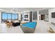 Bright living room with a pool table, fireplace, and sliding doors to the patio at 1487 Reims Dr, Henderson, NV 89012
