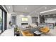 Bright open-concept living room featuring a fireplace, wet bar, and modern finishes at 1487 Reims Dr, Henderson, NV 89012