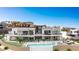 Expansive property features an outdoor living area, infinity pool, and desert landscape at 1487 Reims Dr, Henderson, NV 89012