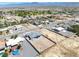 Aerial view of a house with a large fenced backyard and neighborhood view at 1691 Blackhorn St, Pahrump, NV 89048