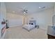 Guest bedroom with gray upholstered bed and electric fireplace at 1691 Blackhorn St, Pahrump, NV 89048