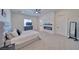 Main bedroom with gray upholstered bed, fireplace, and TV at 1691 Blackhorn St, Pahrump, NV 89048