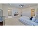 Main bedroom with gray upholstered bed, fireplace, and ensuite bathroom at 1691 Blackhorn St, Pahrump, NV 89048