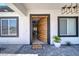 Open entryway with a modern wood front door leading into the home at 1691 Blackhorn St, Pahrump, NV 89048