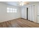 Bedroom featuring wood-look flooring, shutters, and a curtained closet at 204 Orland St # 2, Las Vegas, NV 89107