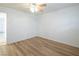 This bedroom offers clean white walls, hardwood floors, and a ceiling fan with a light at 204 Orland St # 2, Las Vegas, NV 89107