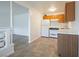 Kitchen features white appliances, wooden cabinets and tiled floors at 204 Orland St # 2, Las Vegas, NV 89107