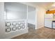 Kitchen and living room space with tile flooring and white lattice detail at 204 Orland St # 2, Las Vegas, NV 89107