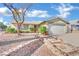 Charming single-story home with desert landscaping, a two-car garage, and a beautiful blue sky at 4623 Kearney St, Las Vegas, NV 89147