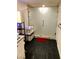 Bathroom featuring a walk-in shower and dark tile floors at 4951 Schumann Dr, Las Vegas, NV 89146