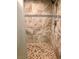 Spacious walk-in shower with neutral tile and handheld shower head at 4951 Schumann Dr, Las Vegas, NV 89146